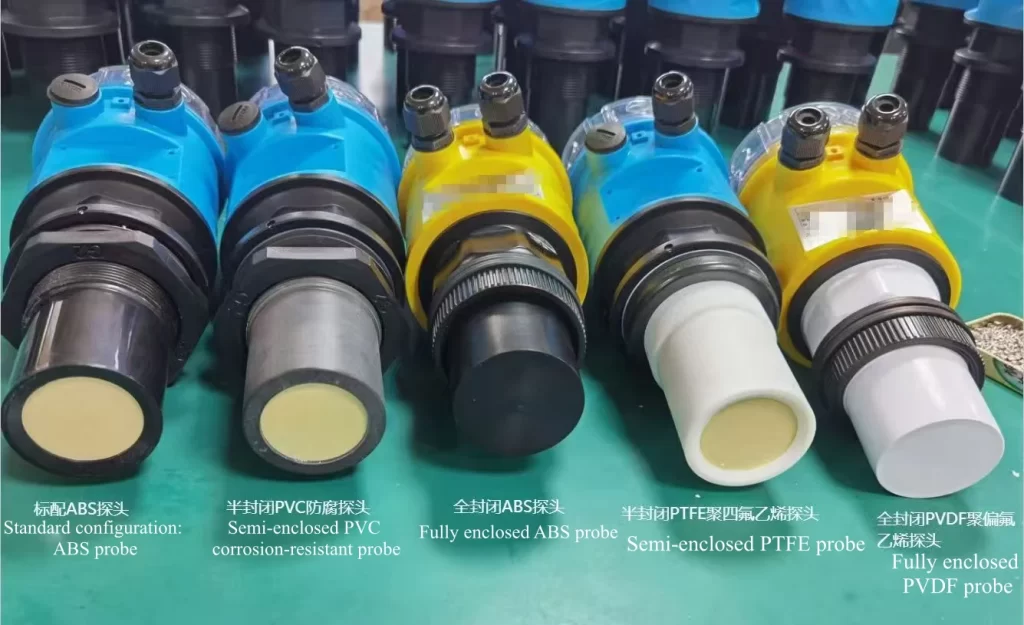 Five ultrasonic level sensor probe types showing ABS, PVC, PTFE, and PVDF materials side by side on factory production line